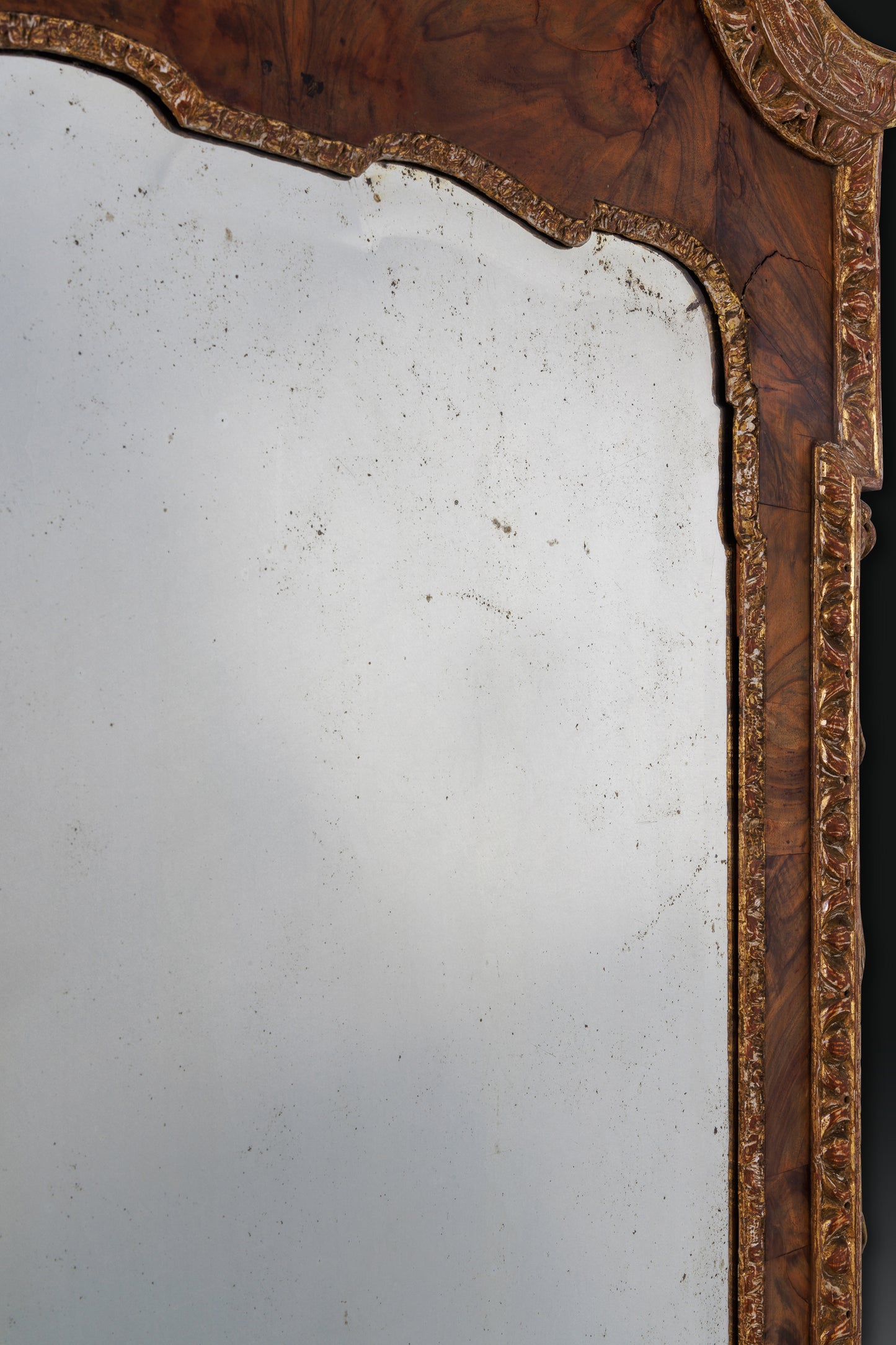Walnut and parcel gilt, dry stripped mirror