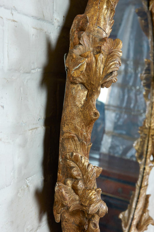 ROCOCO CARVED OVAL LOOKING GLASS, circa 1755