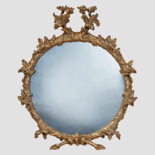 ROCOCO CARVED OVAL LOOKING GLASS, circa 1755