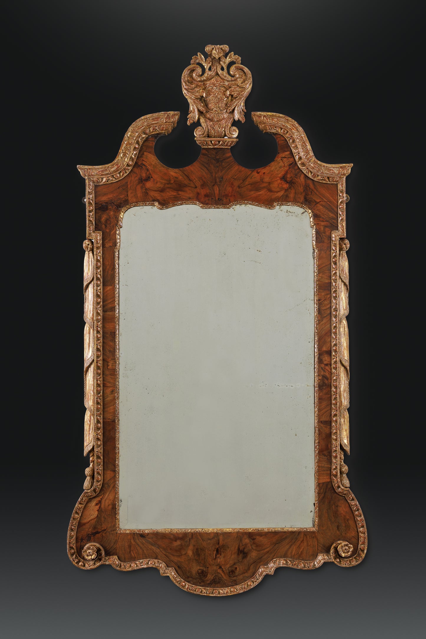 Walnut and parcel gilt, dry stripped mirror