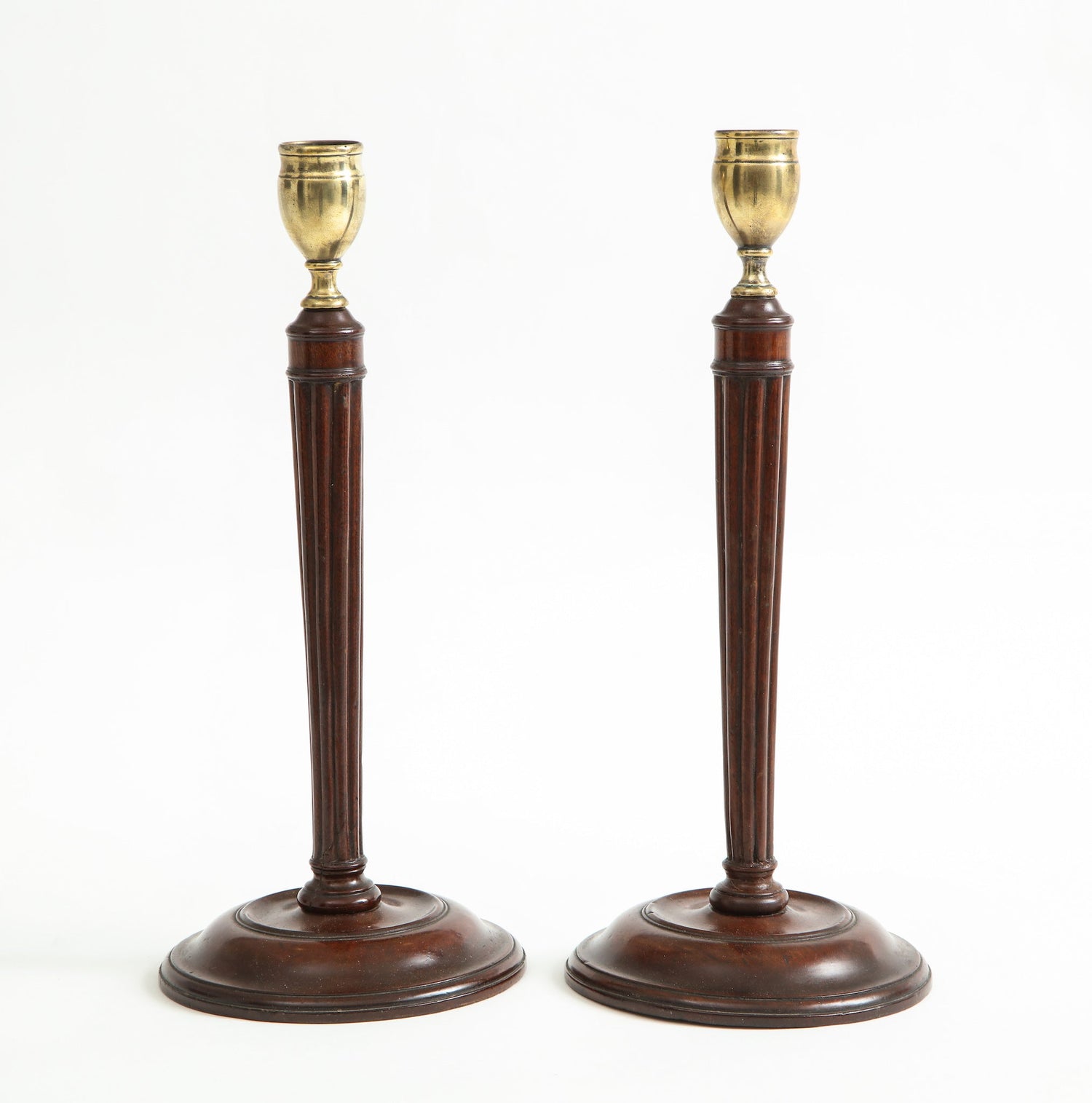 Pair-of-mahogany-and-brass-candlesticks-1